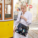 variant:41193745580077 travelon Anti-Theft Addison Tote - Midnight Flora