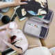 variant:43452763930669 travelon RFID Blocking Family Passport Zip Wallet - Midnight Floral